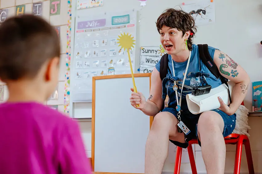 Teacher leading a classroom lesson