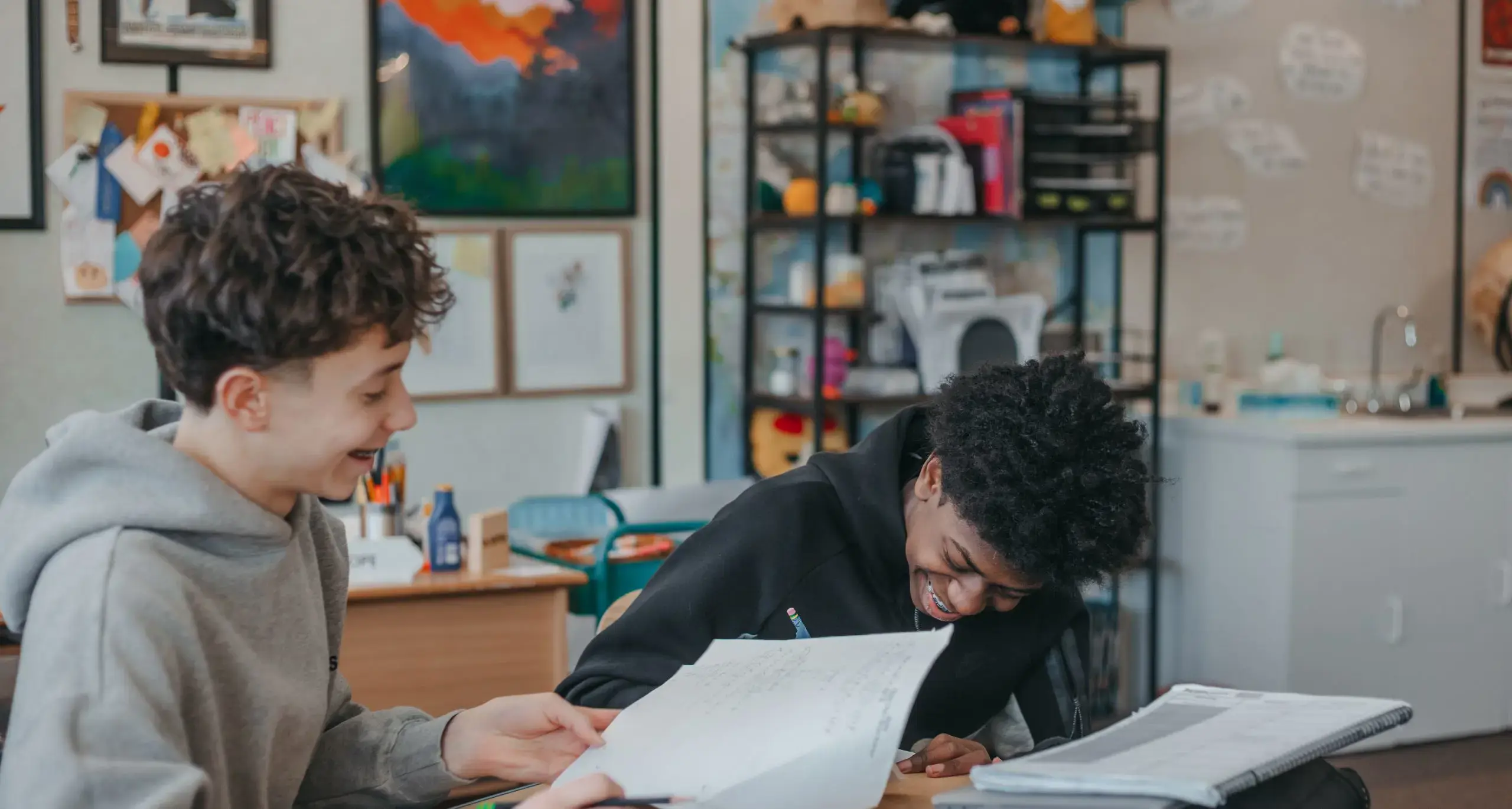 Students writing on a notebook