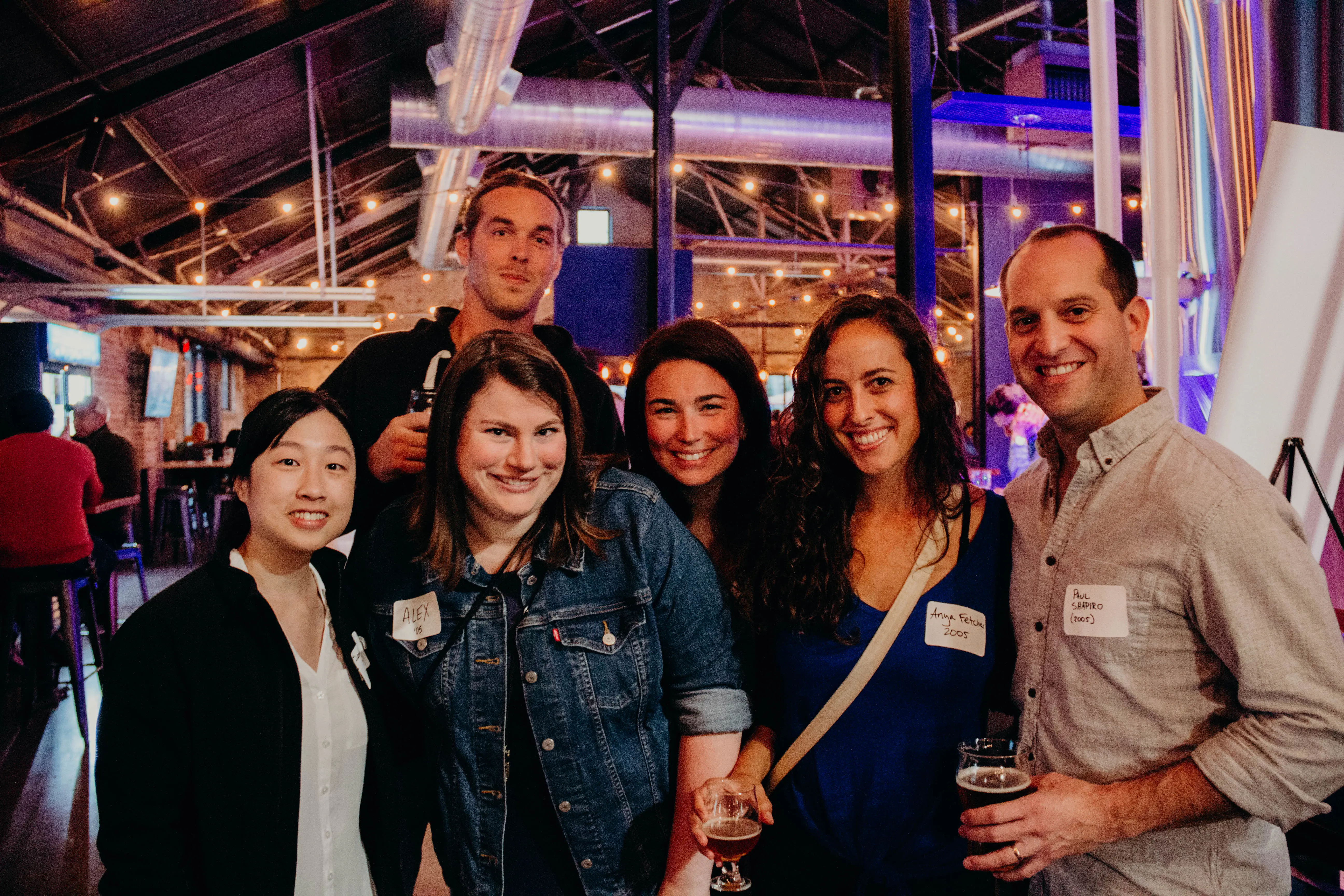 Alumni reconnecting at a school social event.