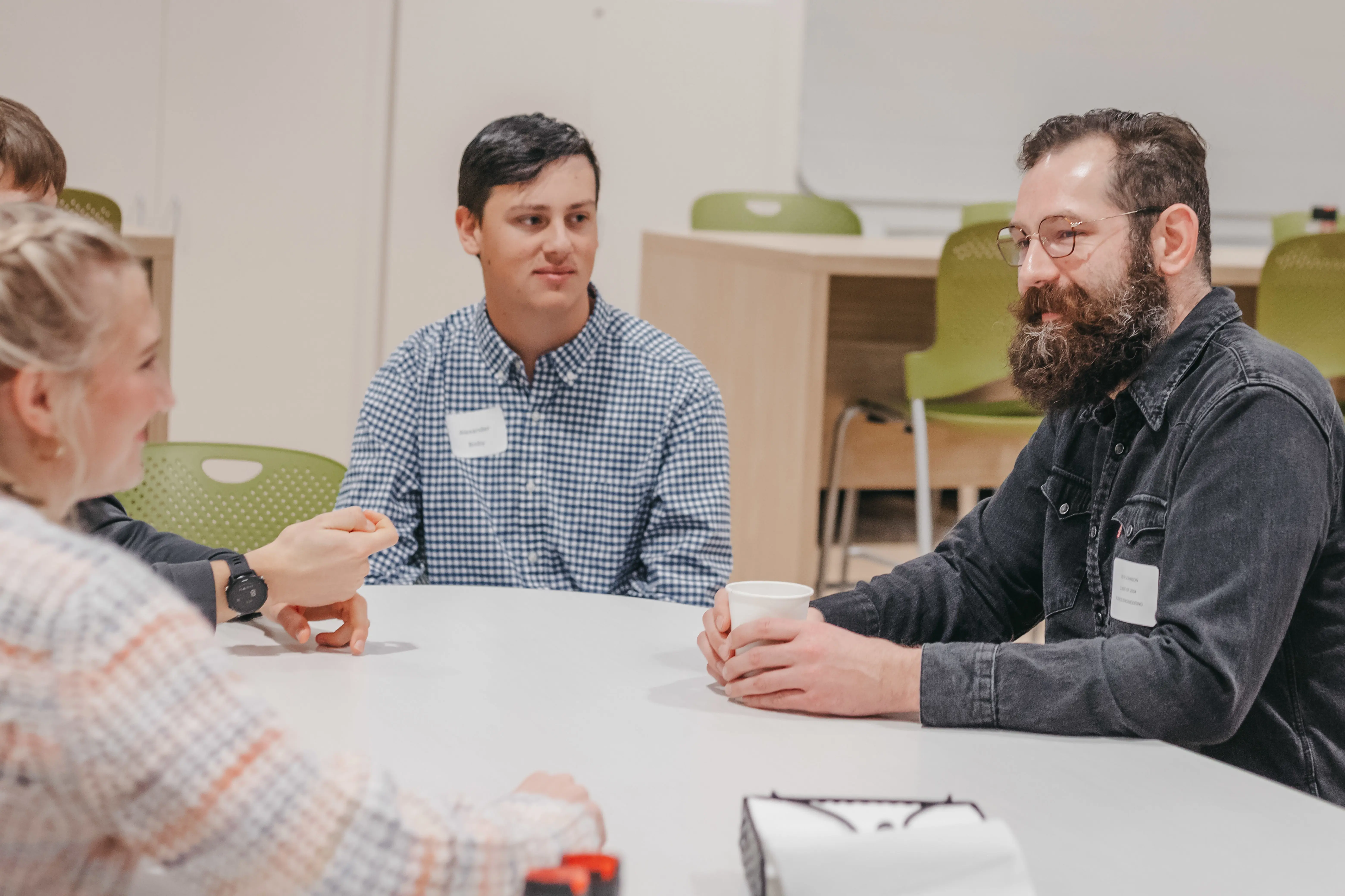 Alumni networking during a group discussion.