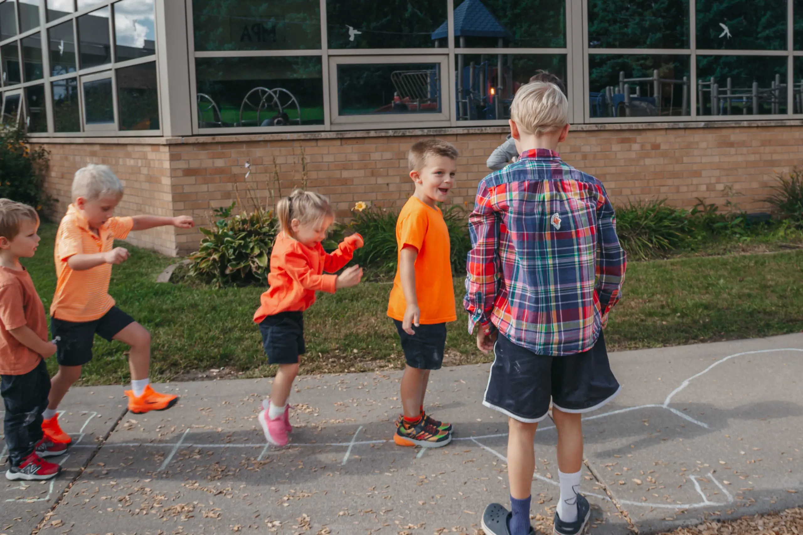 Lower school students playing together at recess.