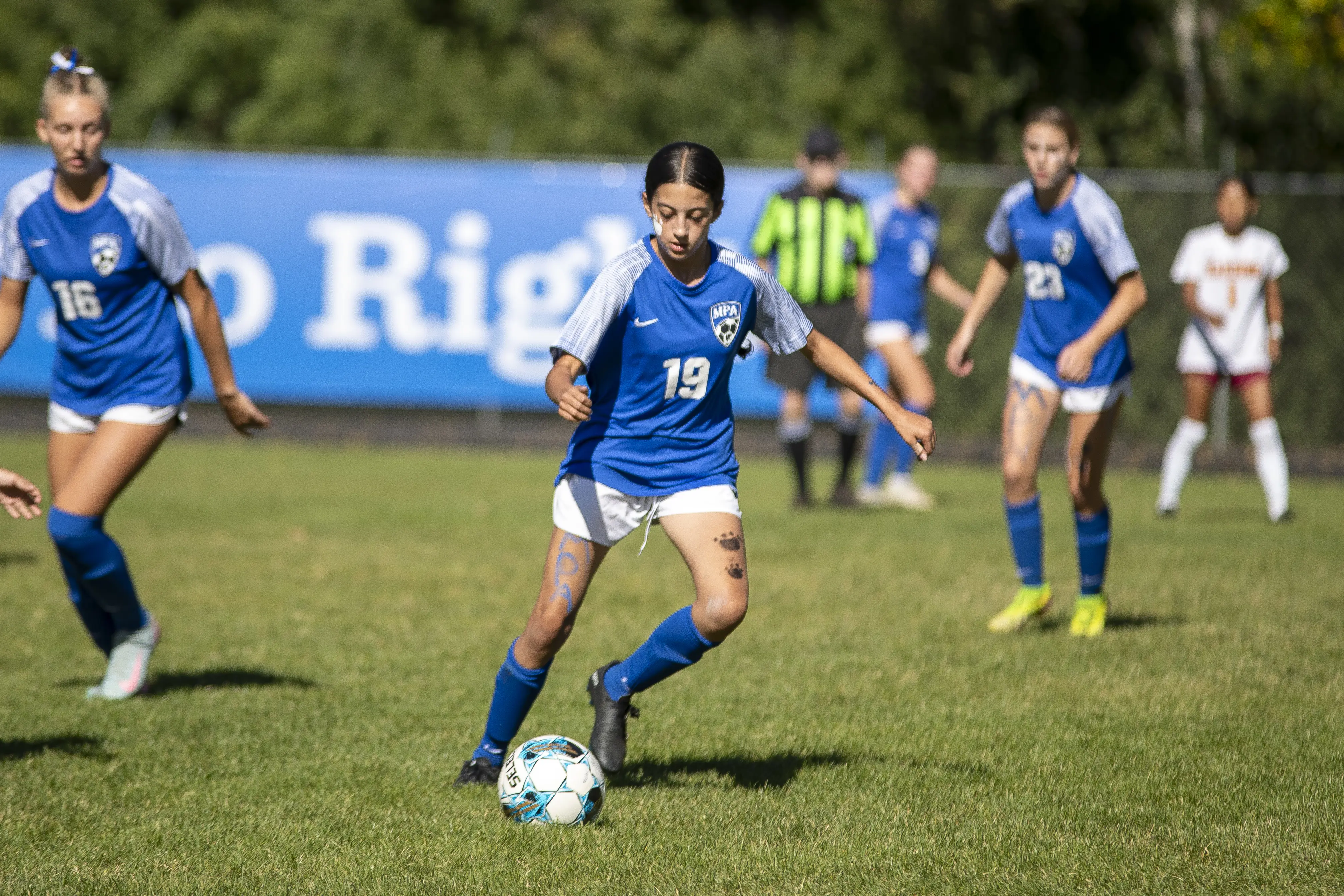 Student playing football during a tournament
