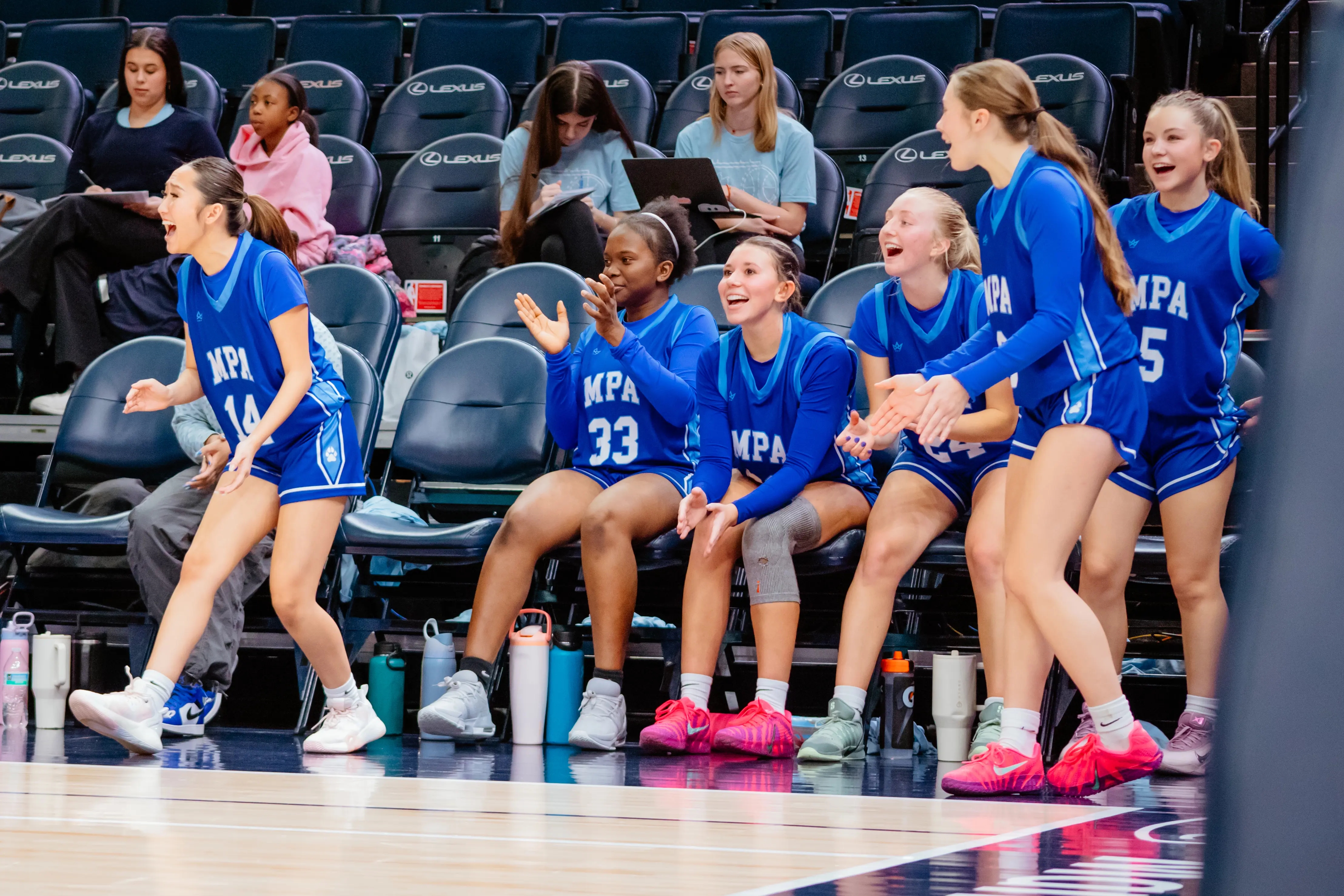 Students celebrating in a volleyball match