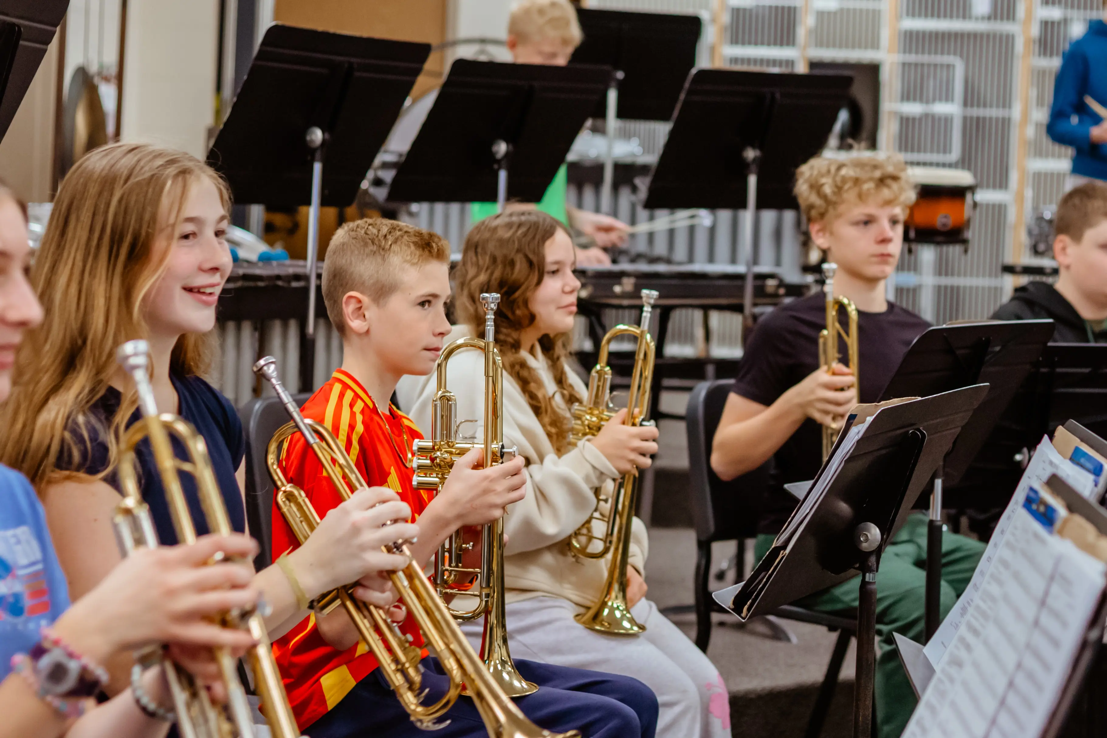 Students playing instruments in band class