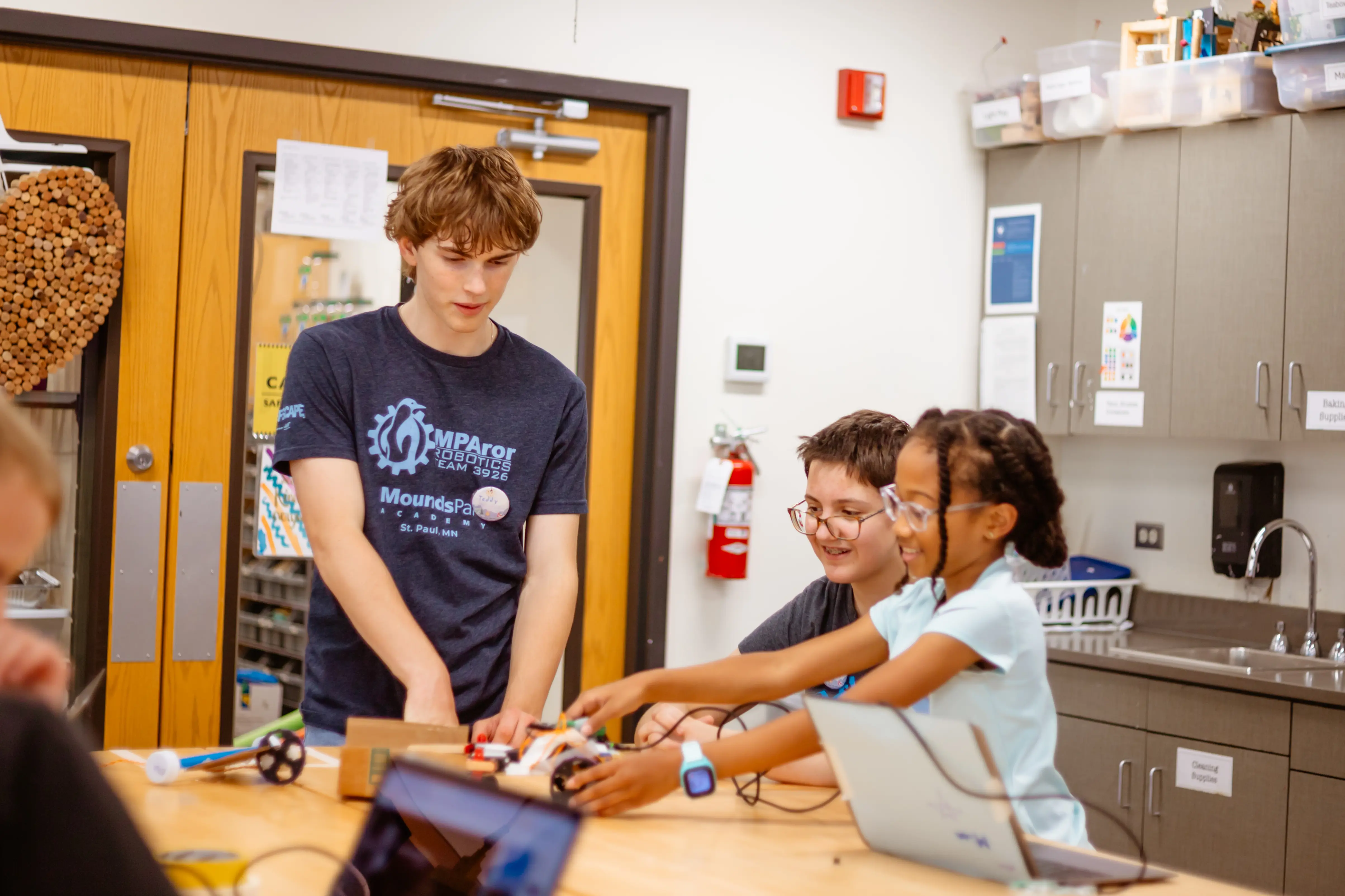 Upper School robotics assists Middle School robotics