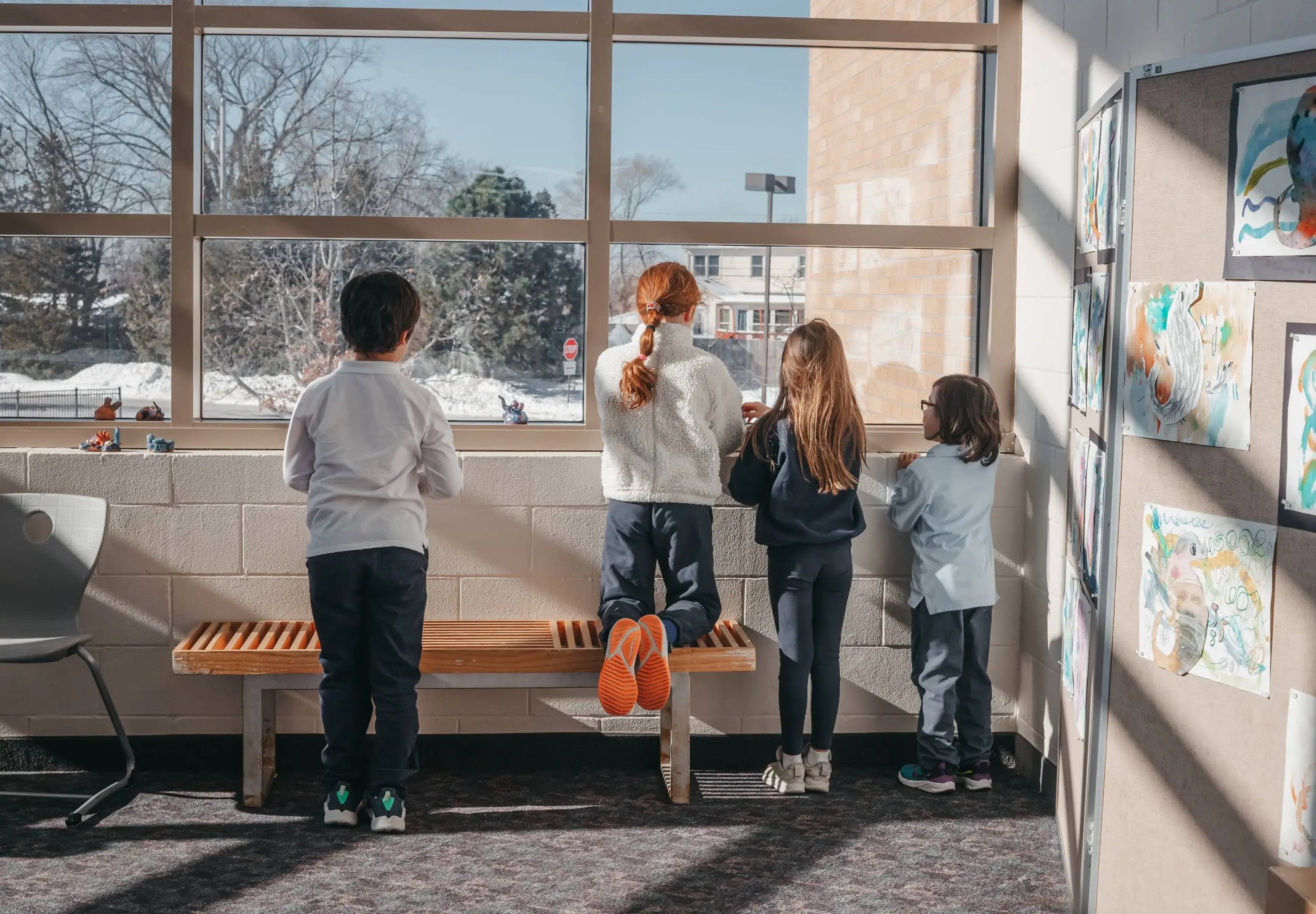 Students Looking Outside Window on Campus
