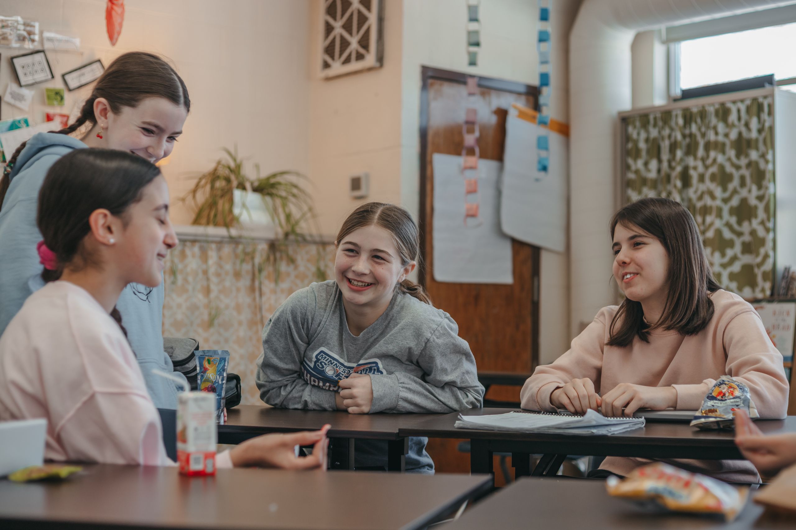 Middle school students engaged in a classroom discussion.
