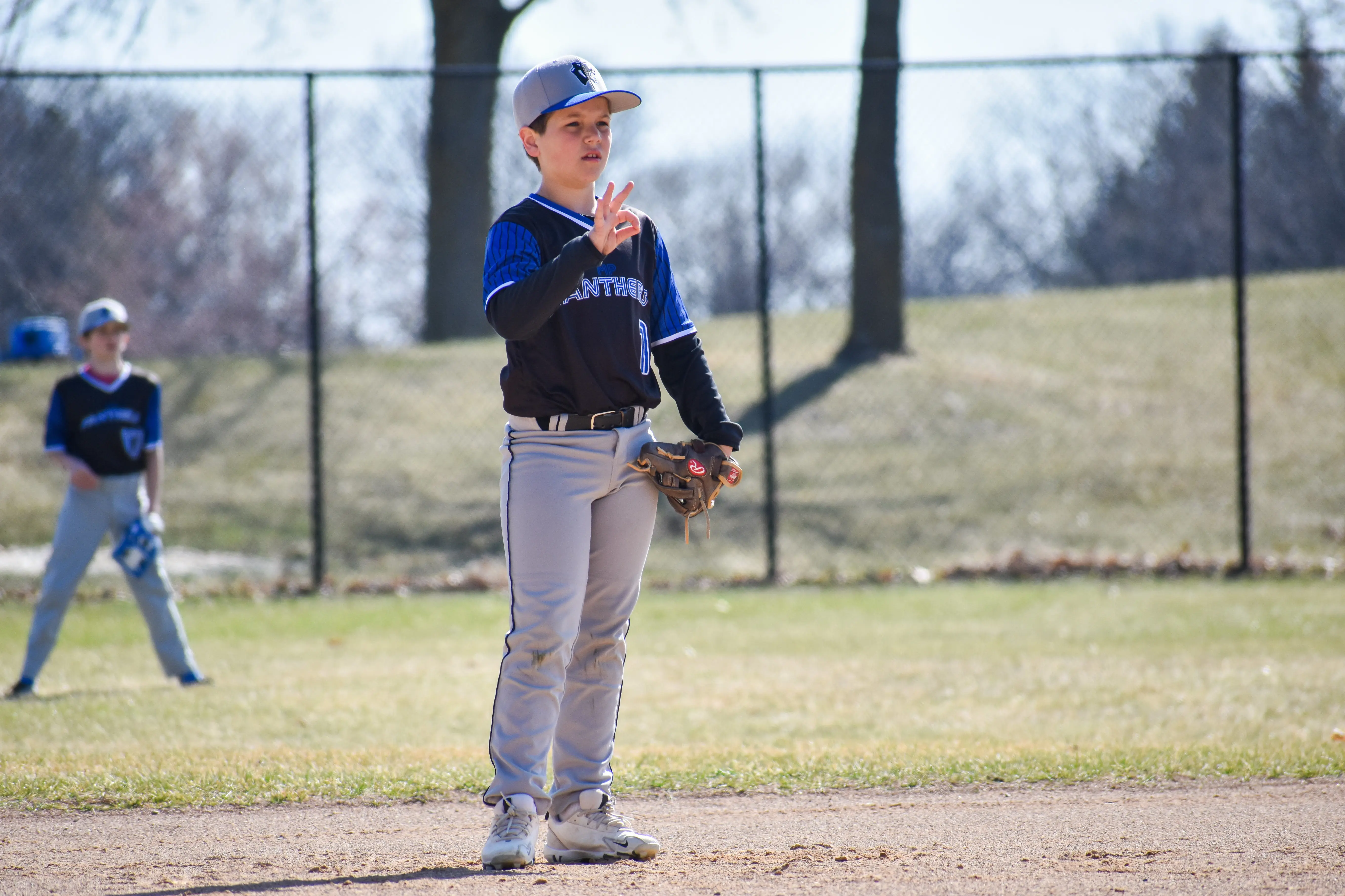 Baseball player preparing to pitch.