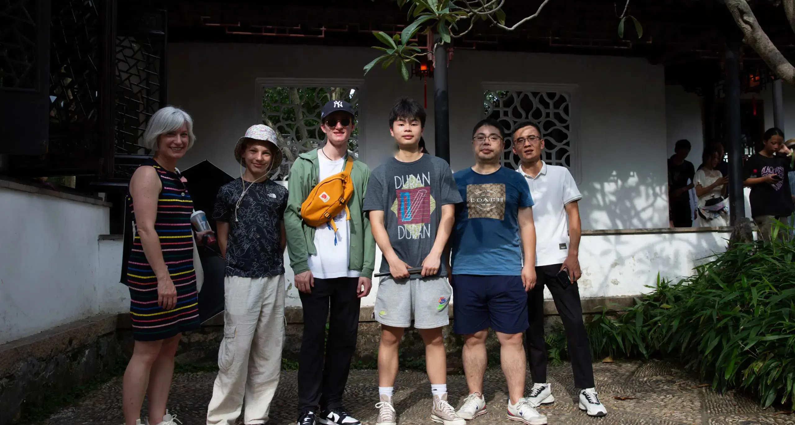 Group of students and adults on an educational trip.