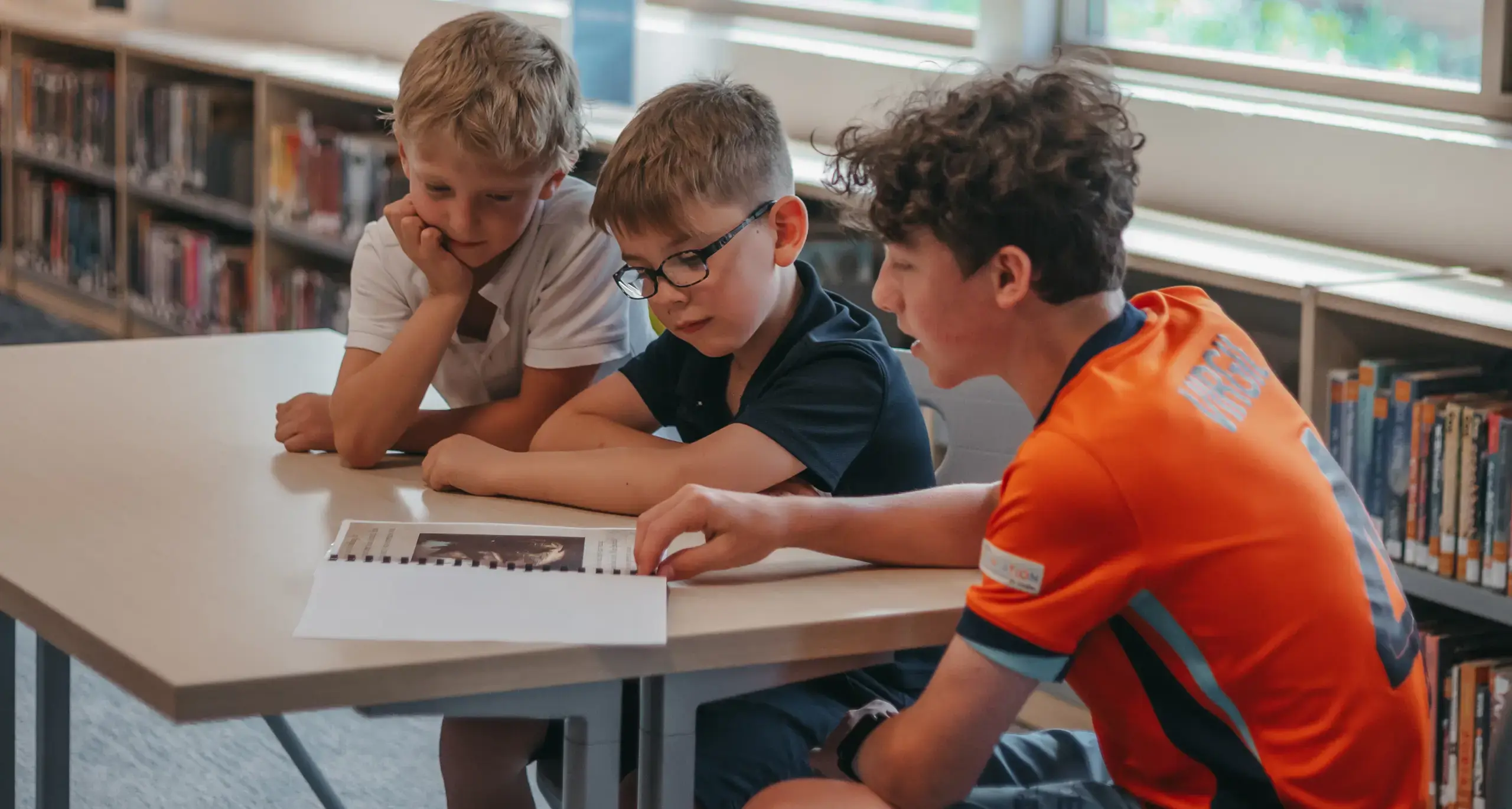 Students reading together in the school library
