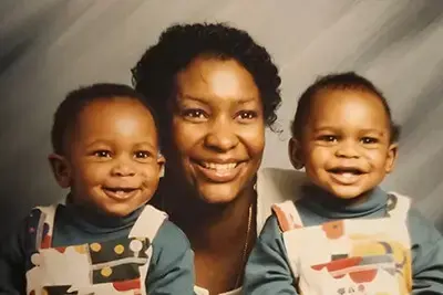 Mother and two kids smiling portrait