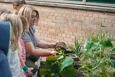PreK working in their garden