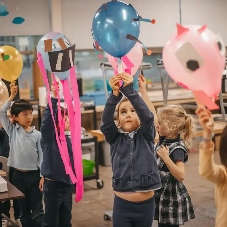 Students playing with balloons