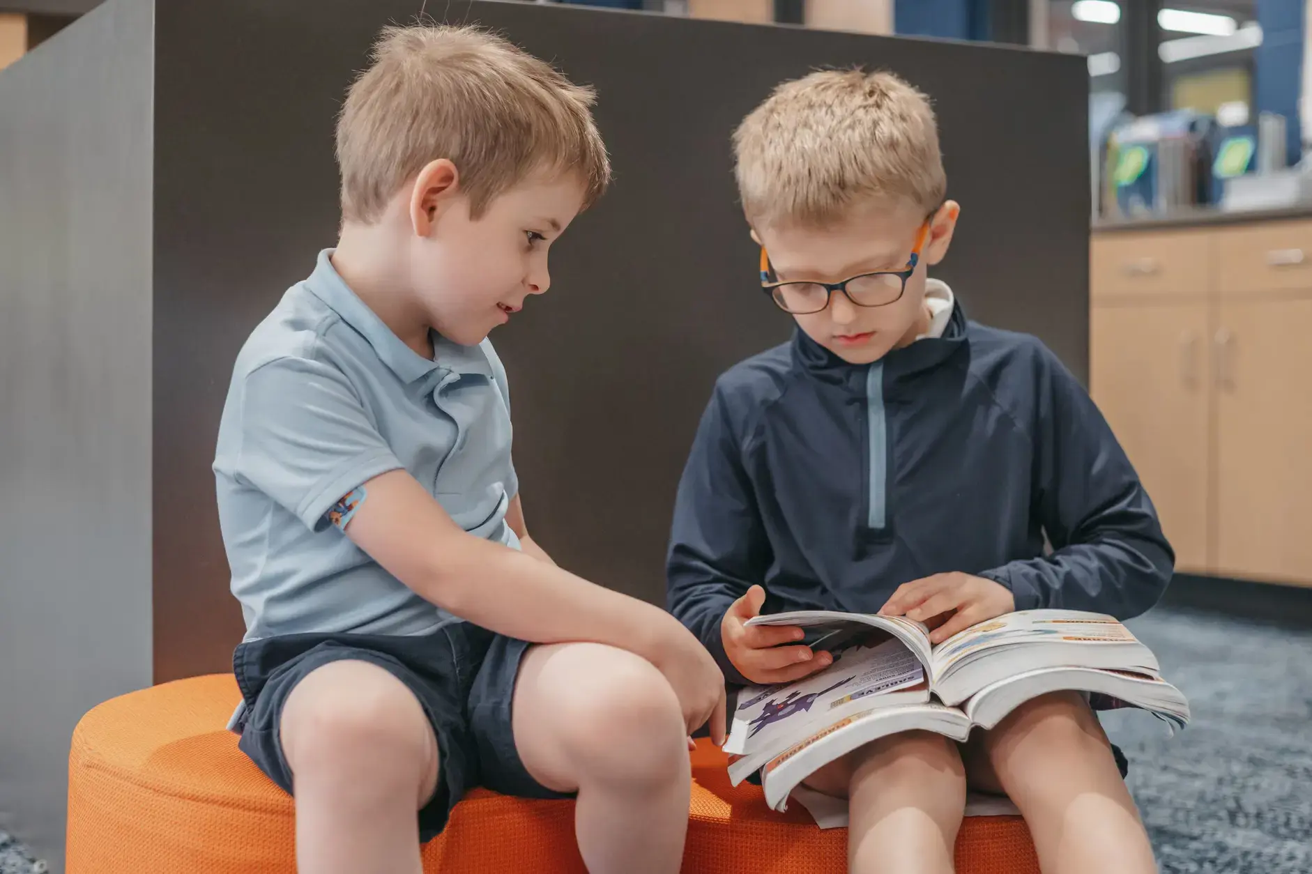 Students reading a book together