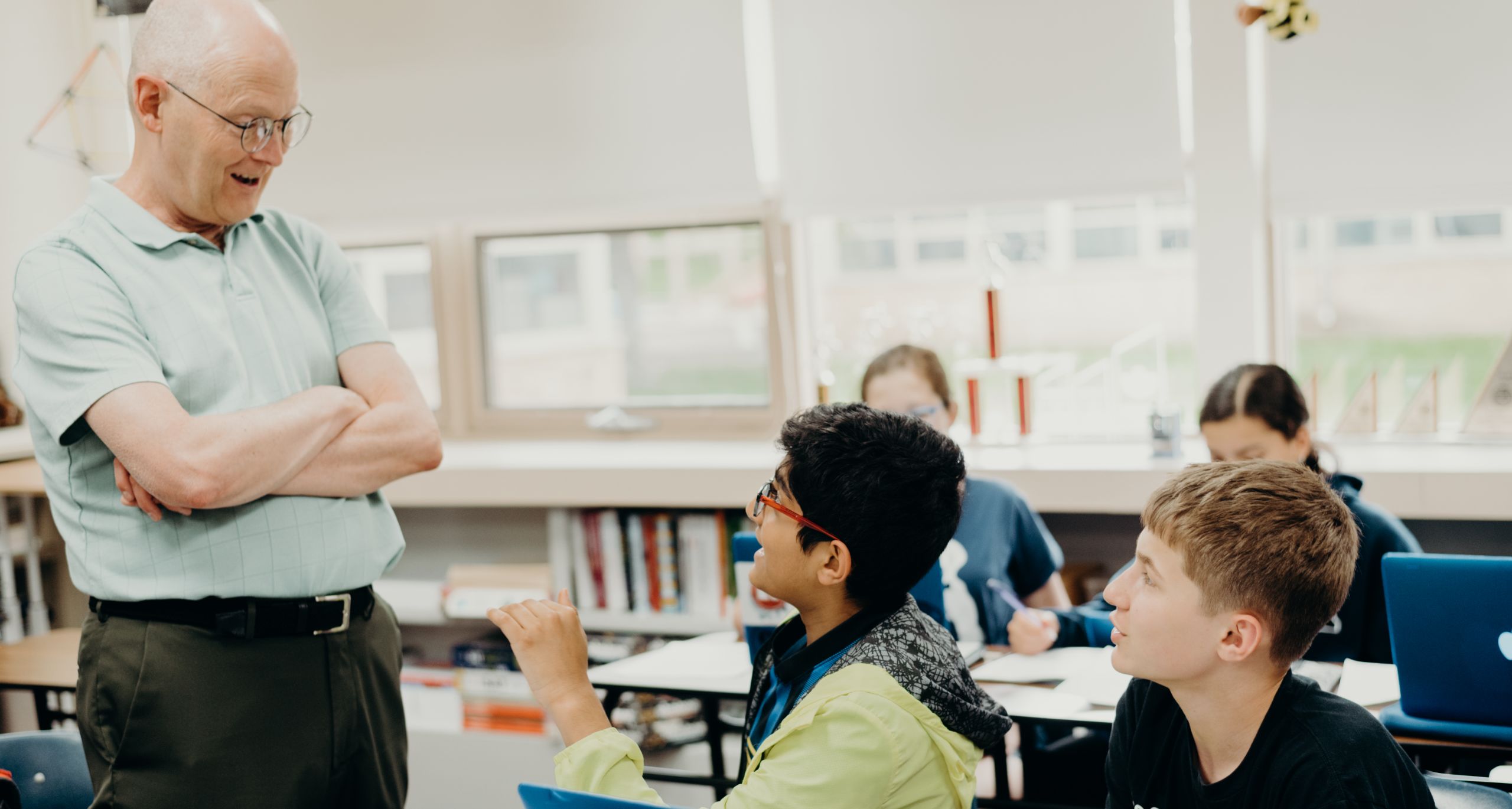 Teacher engaging students in a classroom discussion.