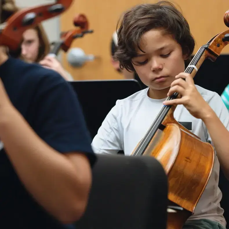 Student playing the chello
