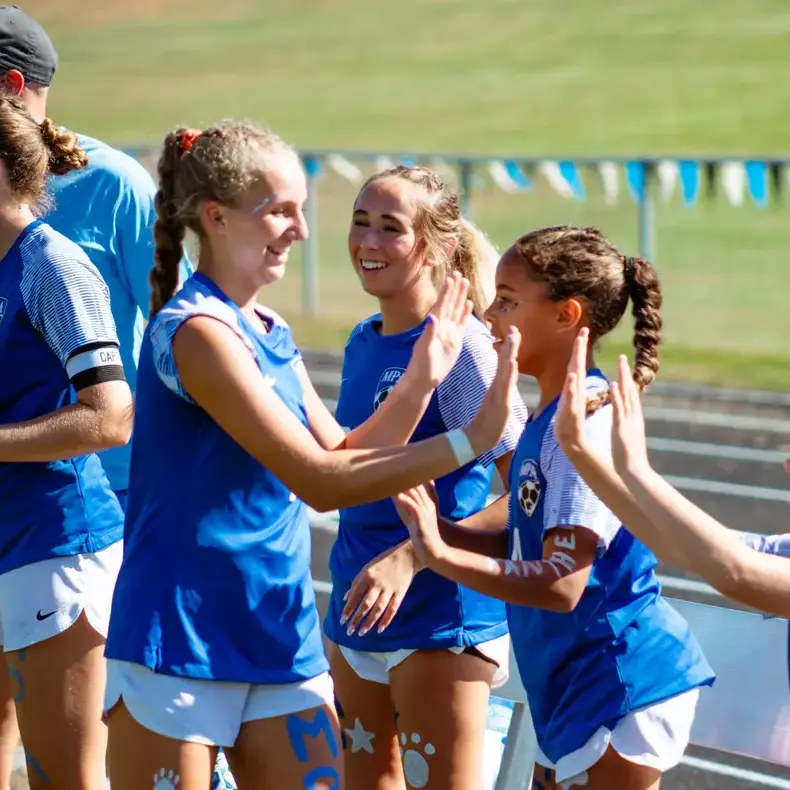Students celebrating during a tournament