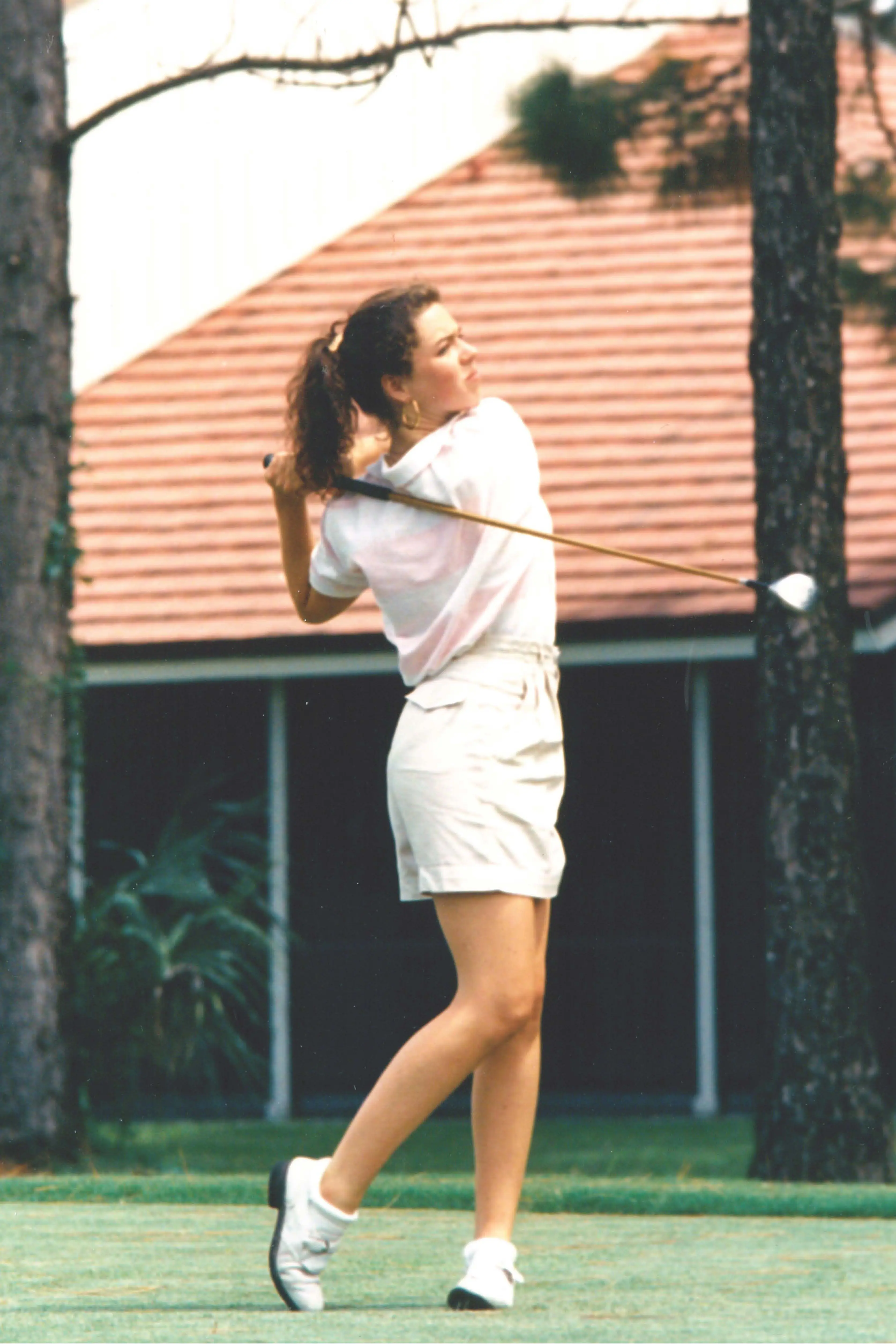 Stacey Geiser playing golf. 
