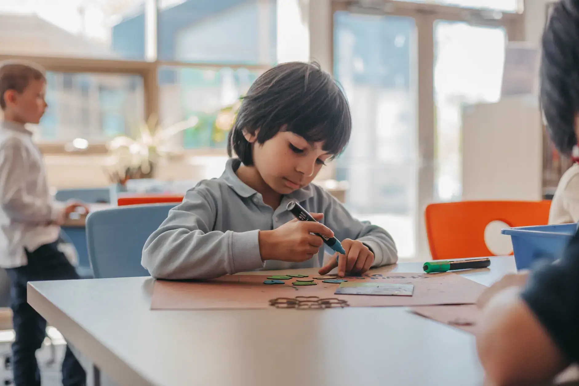 Student drawing during a classroom activity