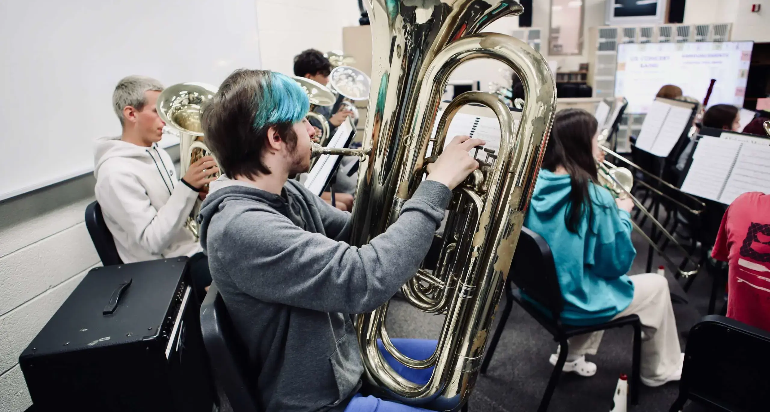 Student playing tuba during band rehearsal