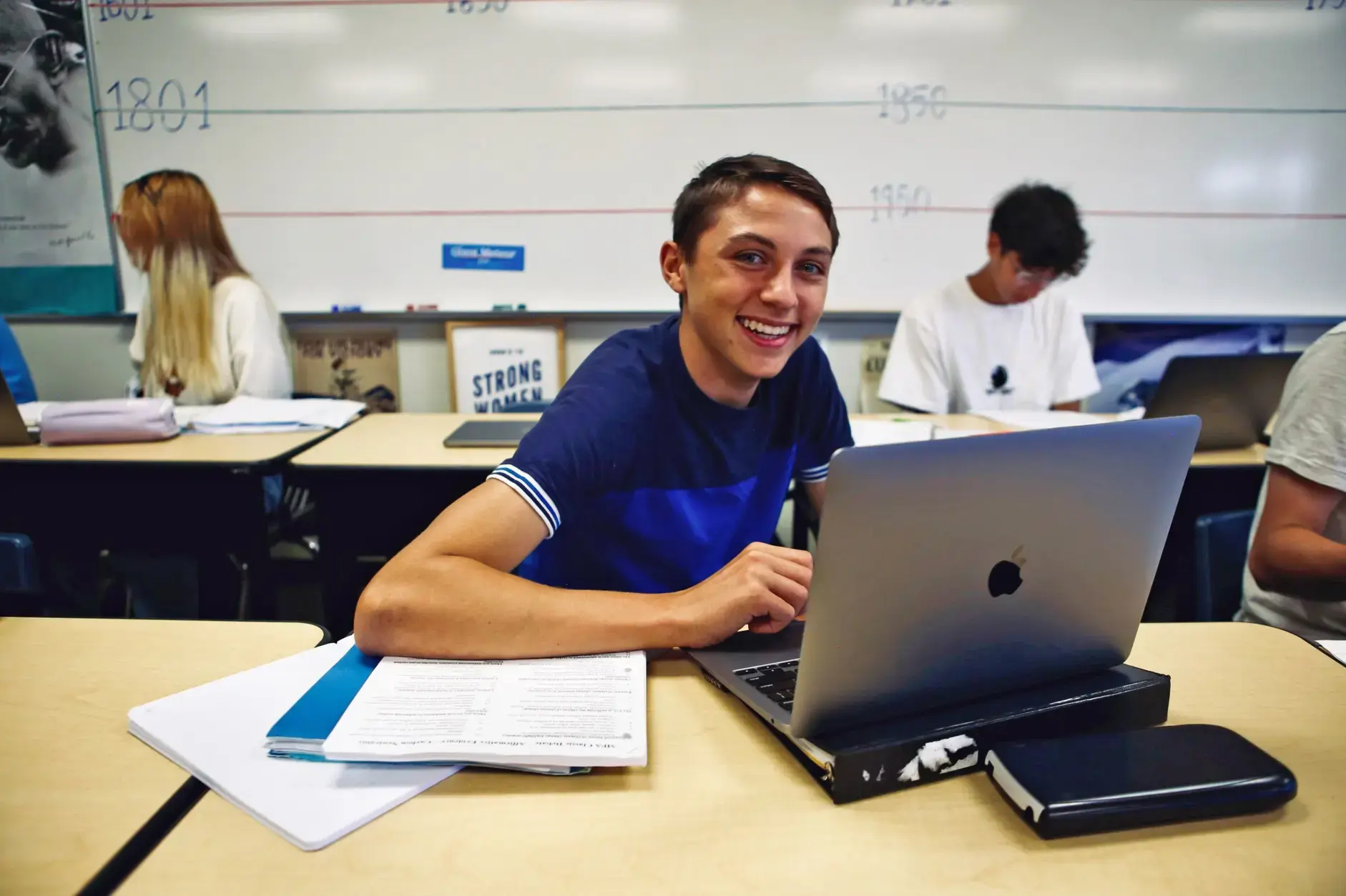 Student working on a laptop in class