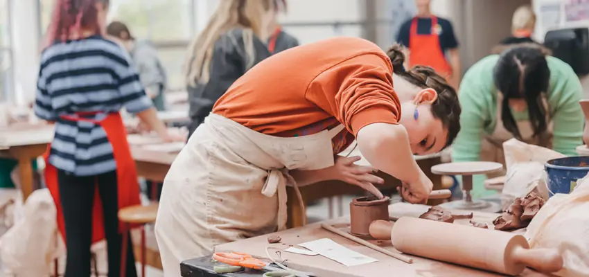 Student creating a ceramic art project