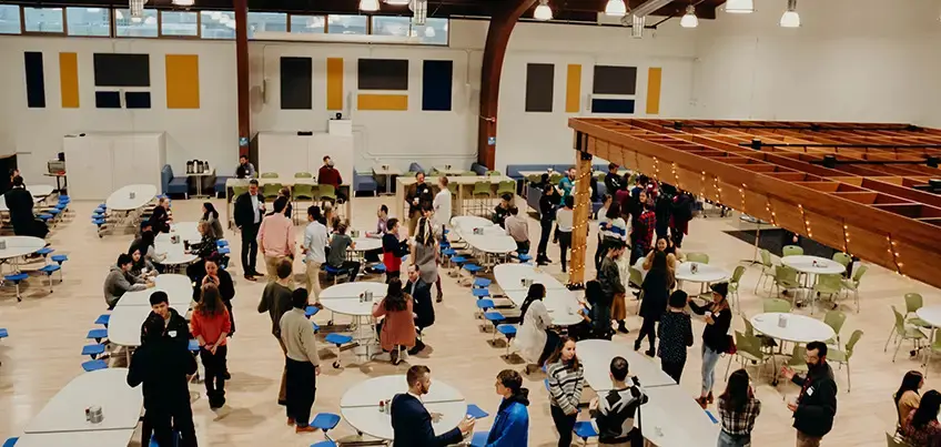 Alumni attending a school community event