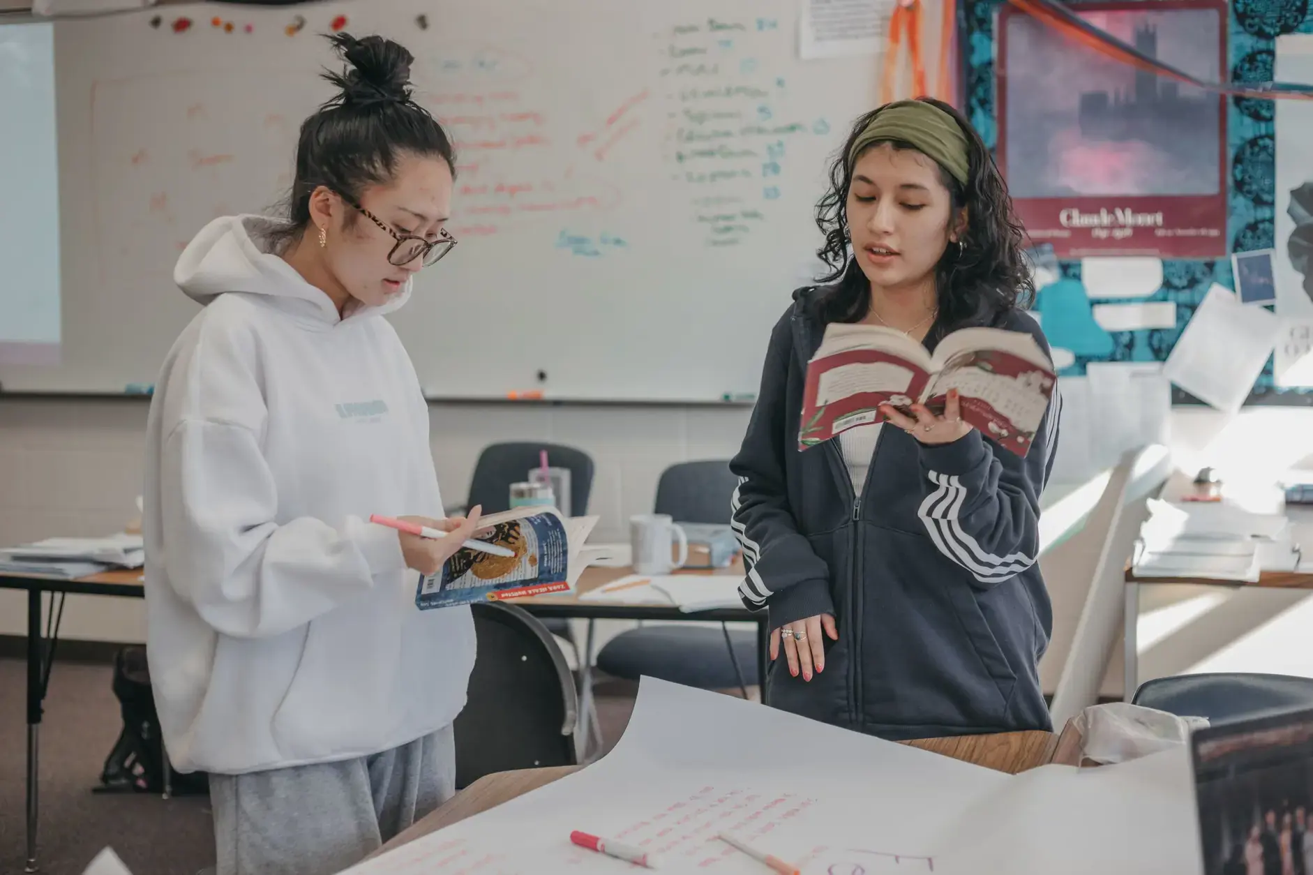 Students discussing and presenting their work during a classroom project