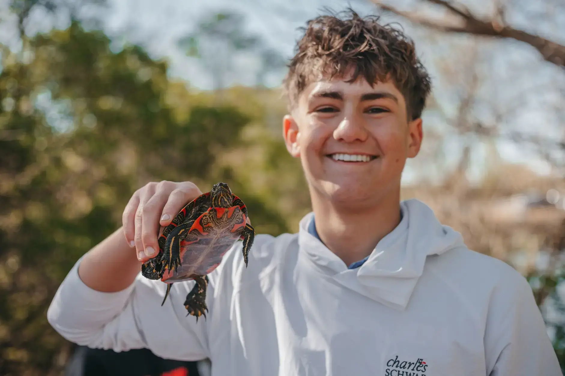 Student holding a tortoise