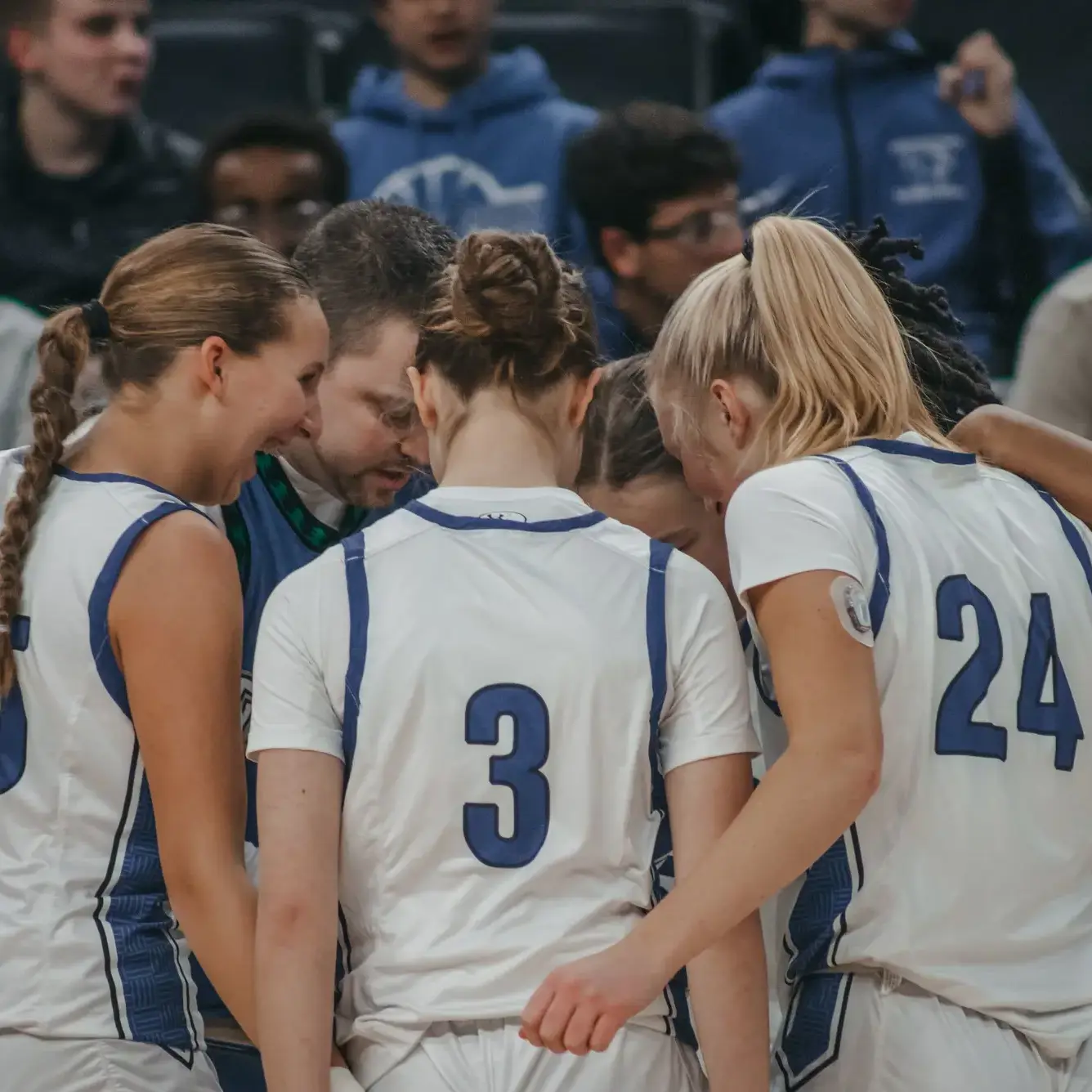 Students huddling together during a game