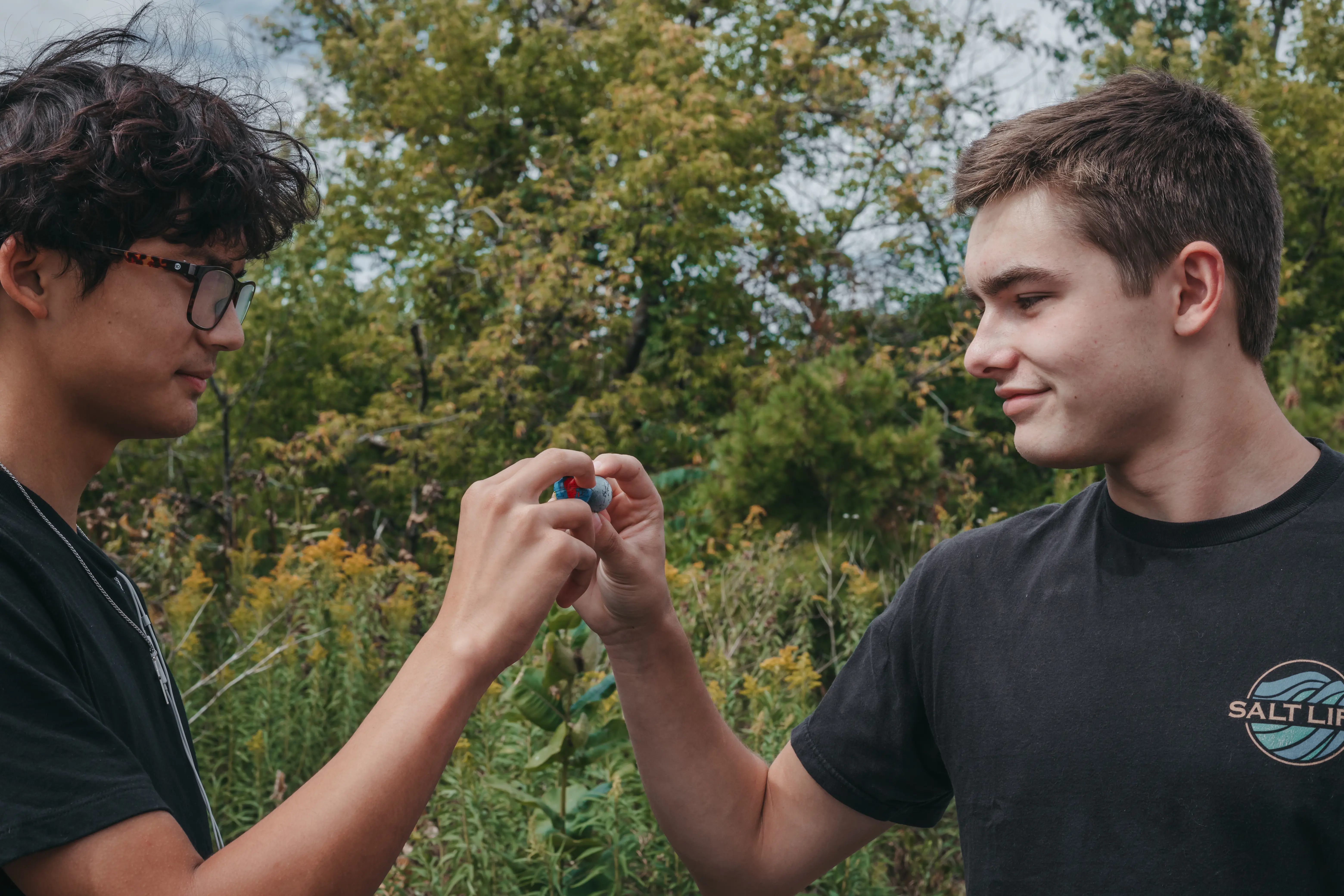 Two Upper School students doing astronomy lesson outdoors