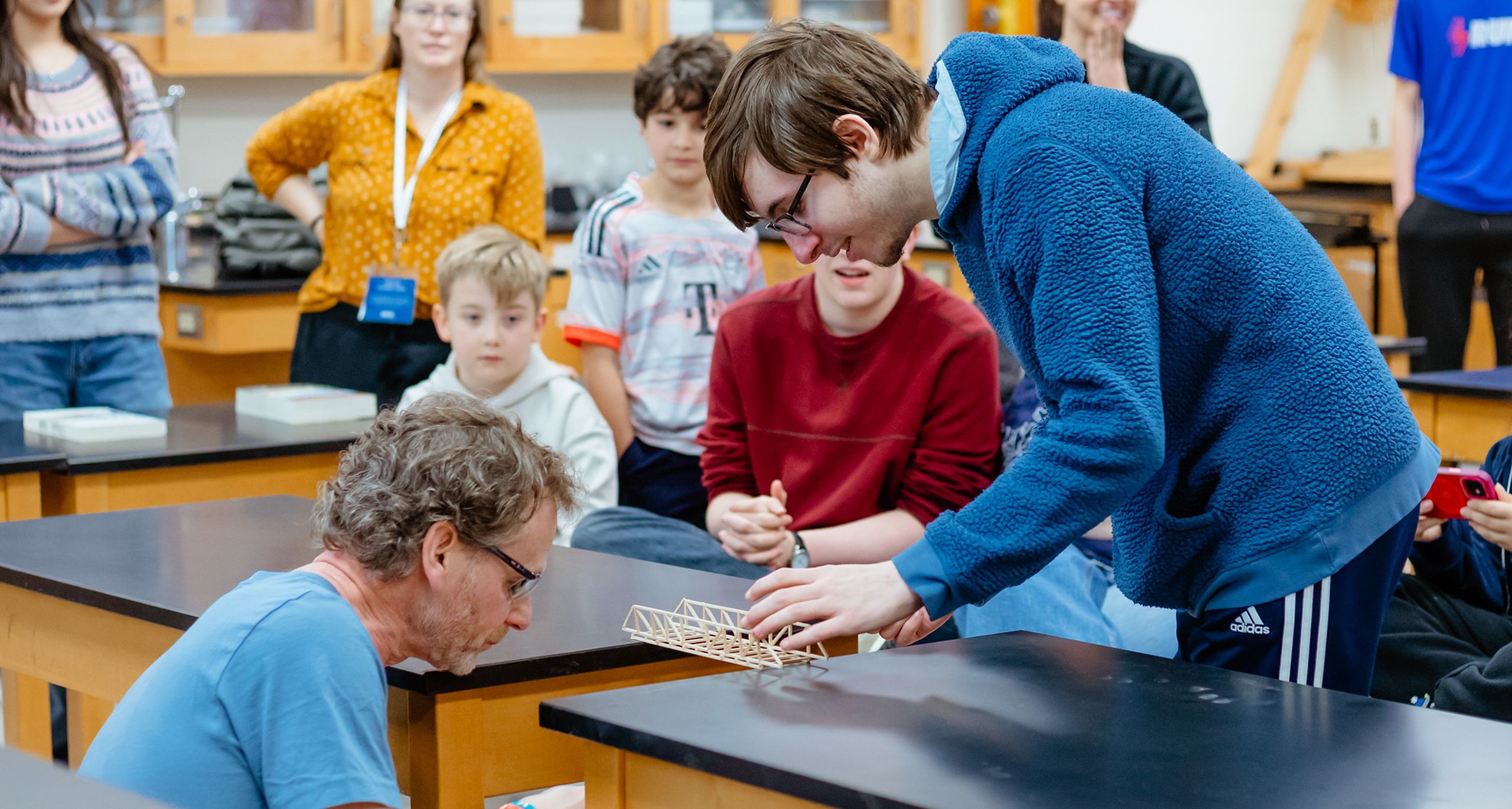 Teacher helping student with a project