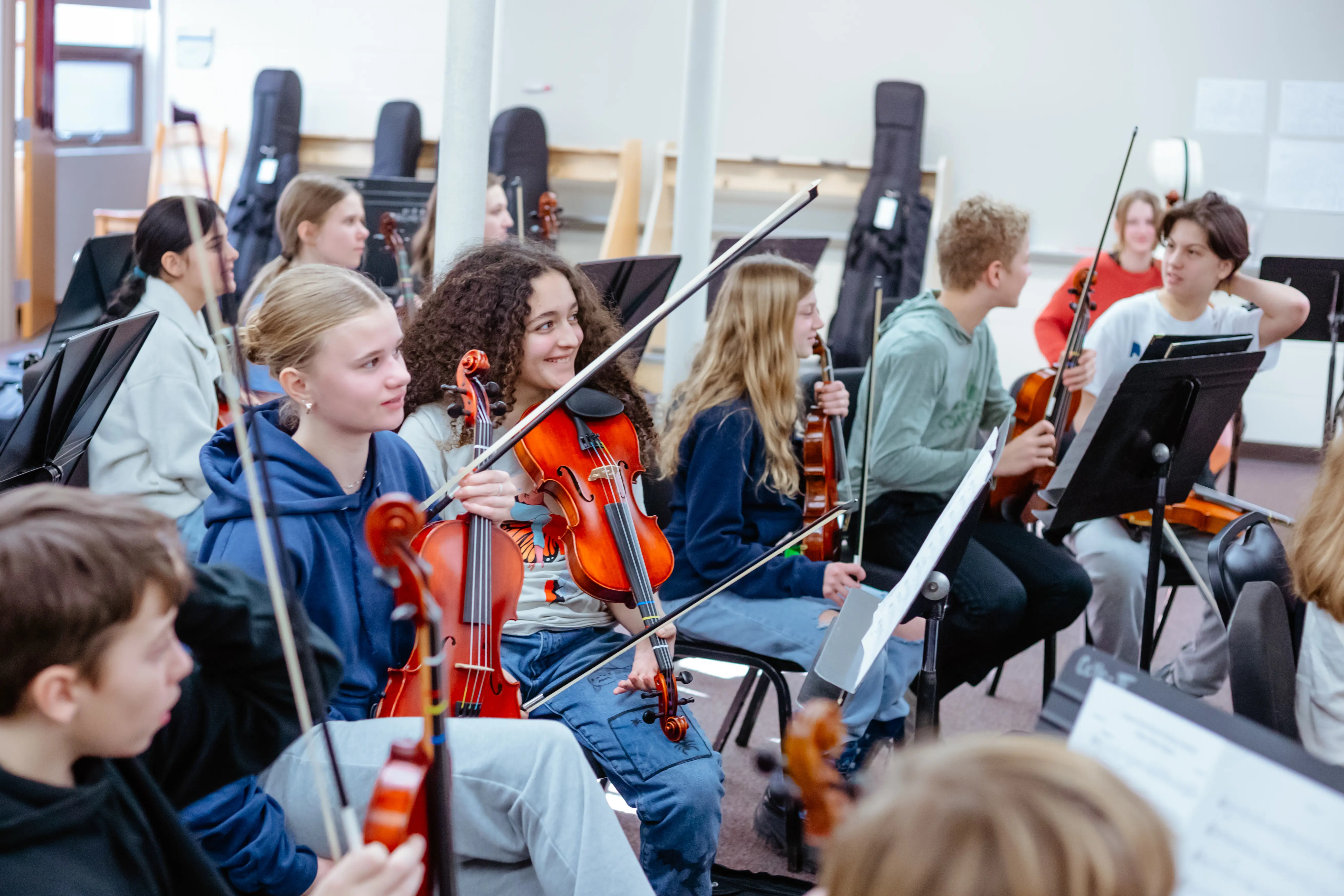 Students rehearsing together in orchestra