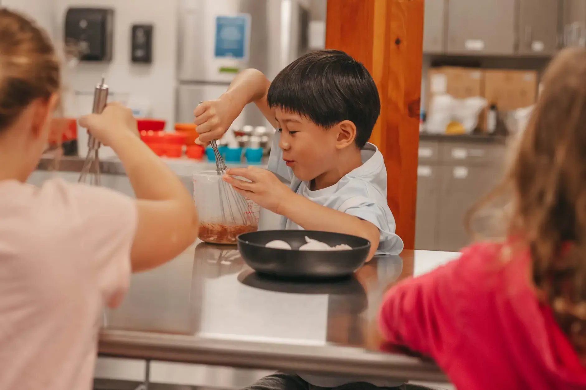 Students participating in cooking lesson