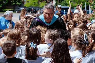 Dr. Bill Hudson surrounded by students
