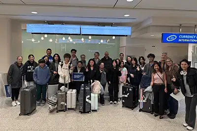 Group photos of students in the airport