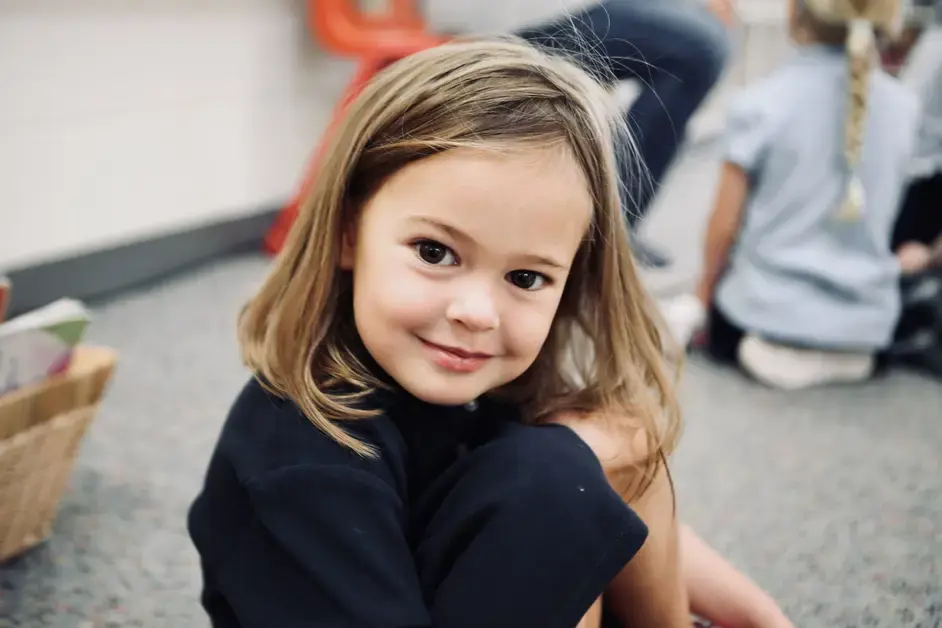 Lower school student smiling at the camera