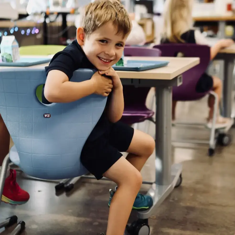 student sitting on a chair in a classroom
