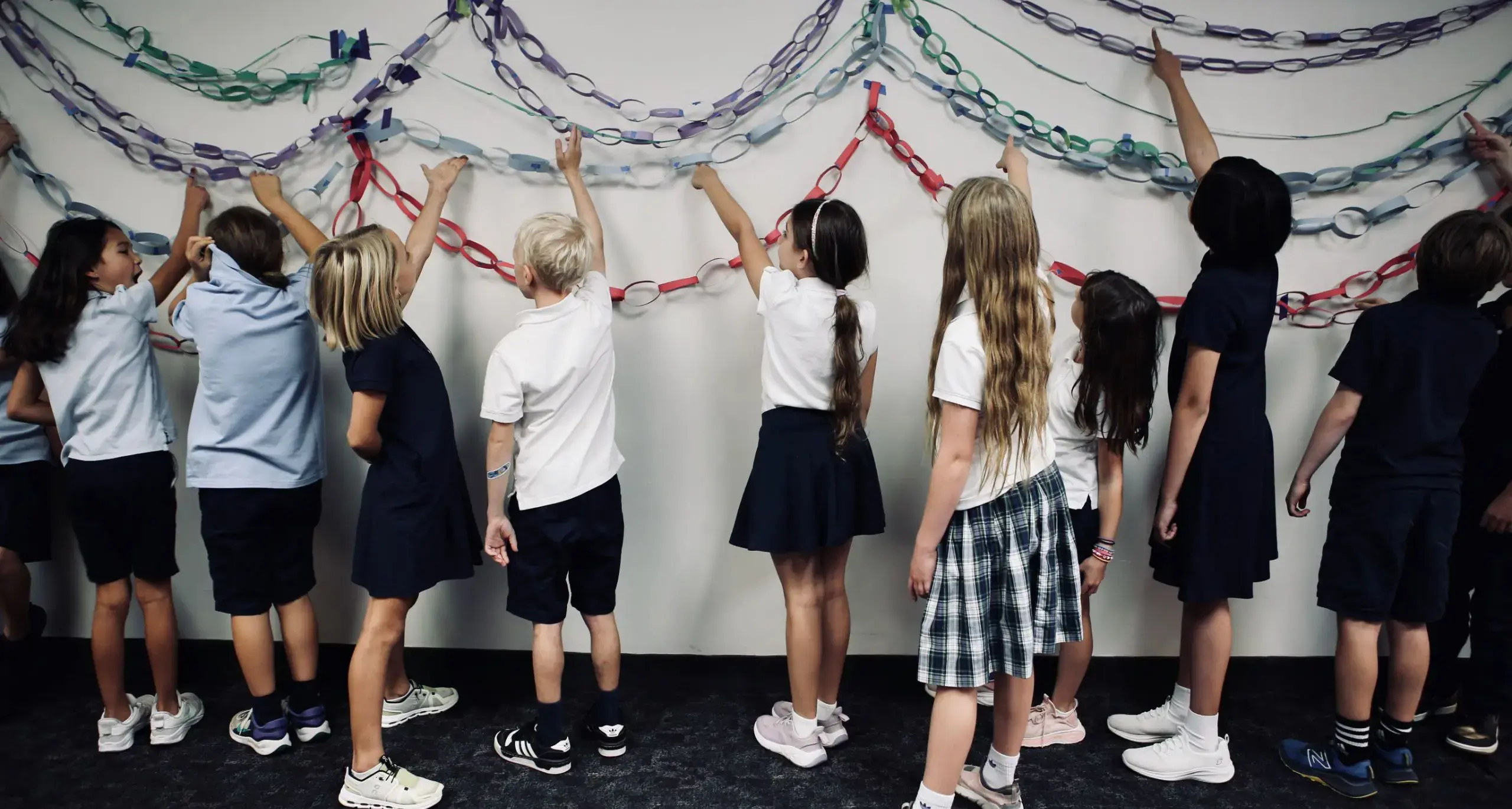 Lower school students creating a collaborative art display.