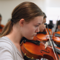 Student playing the violin