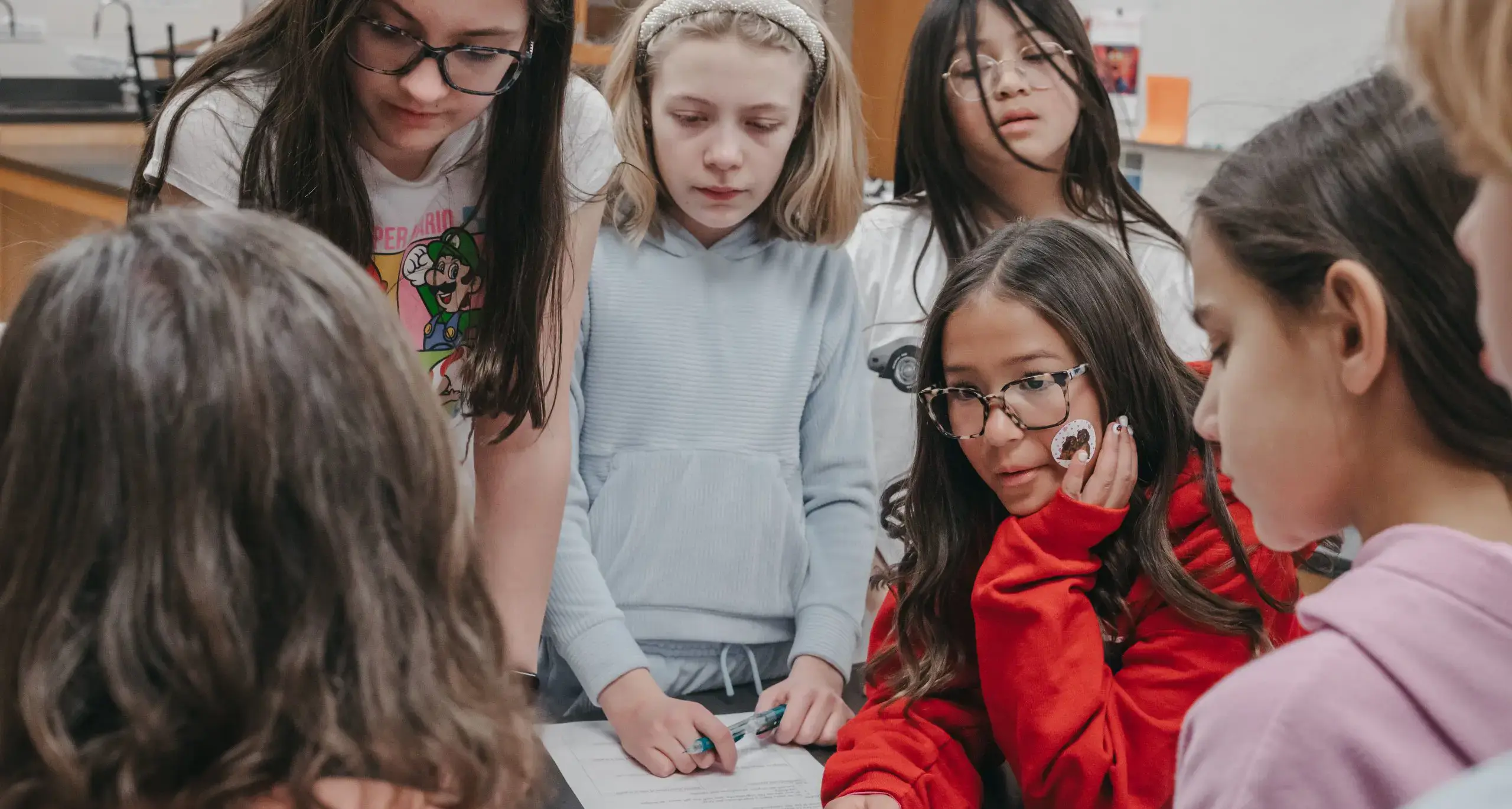 Students collaborating on a classroom group activity.