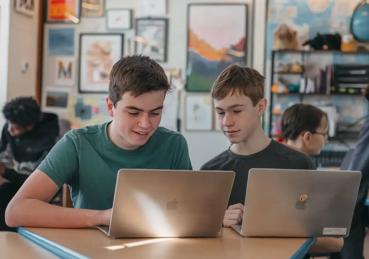 Students doing coursework on their laptops