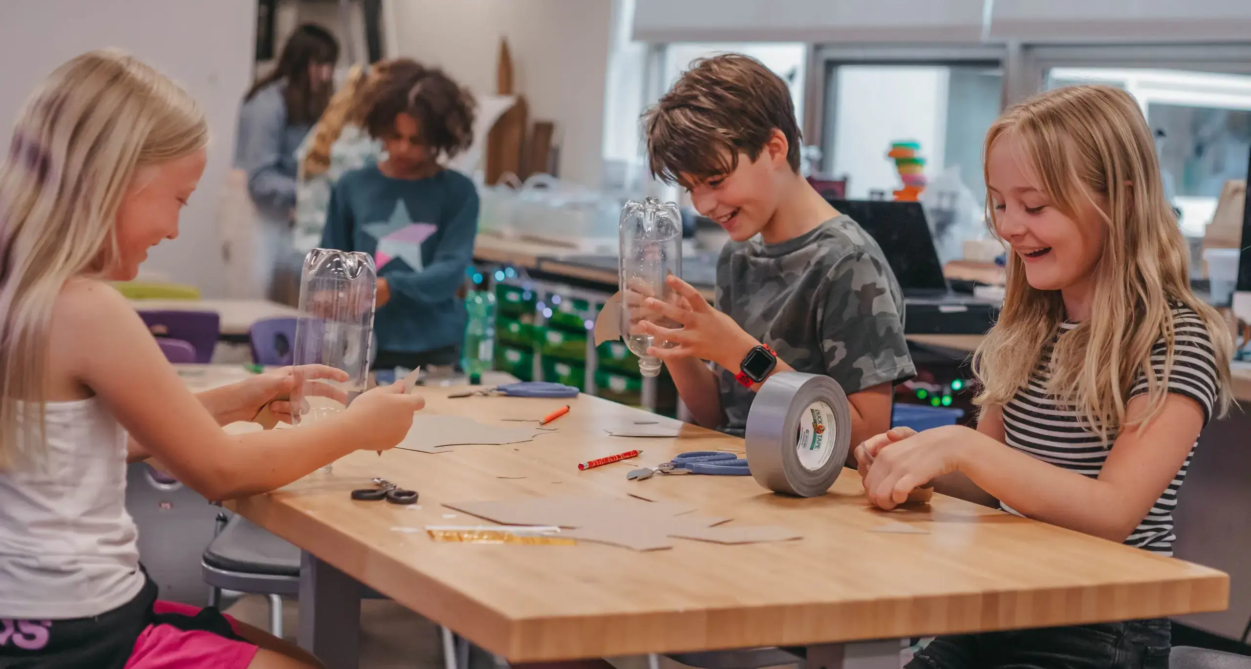 Students building STEM projects together in the classroom.