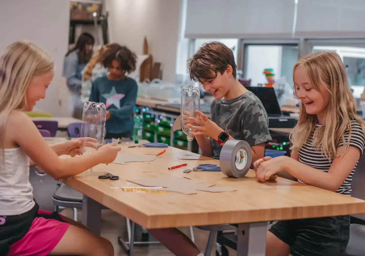 Students making art with recycled materials