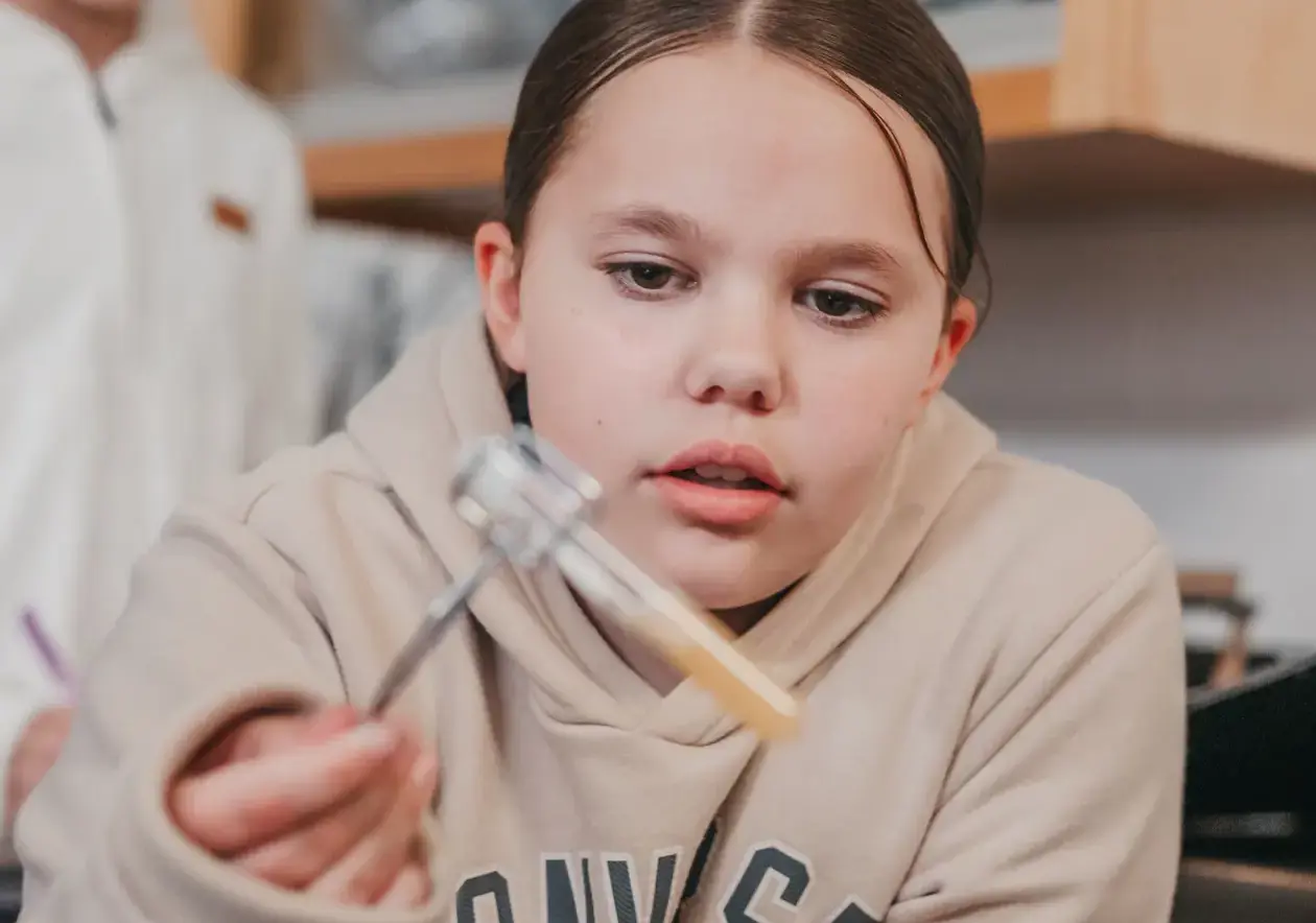 Student engaging in a science class
