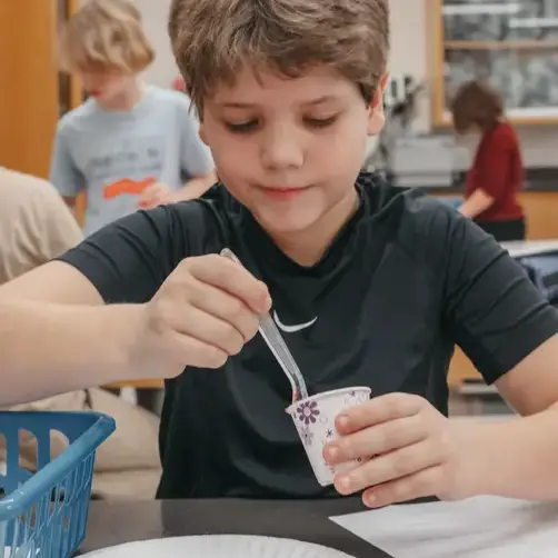 Student in art class painting