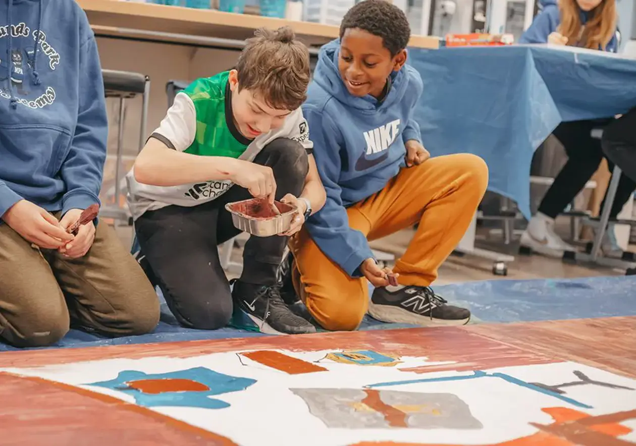 Students in art class painting