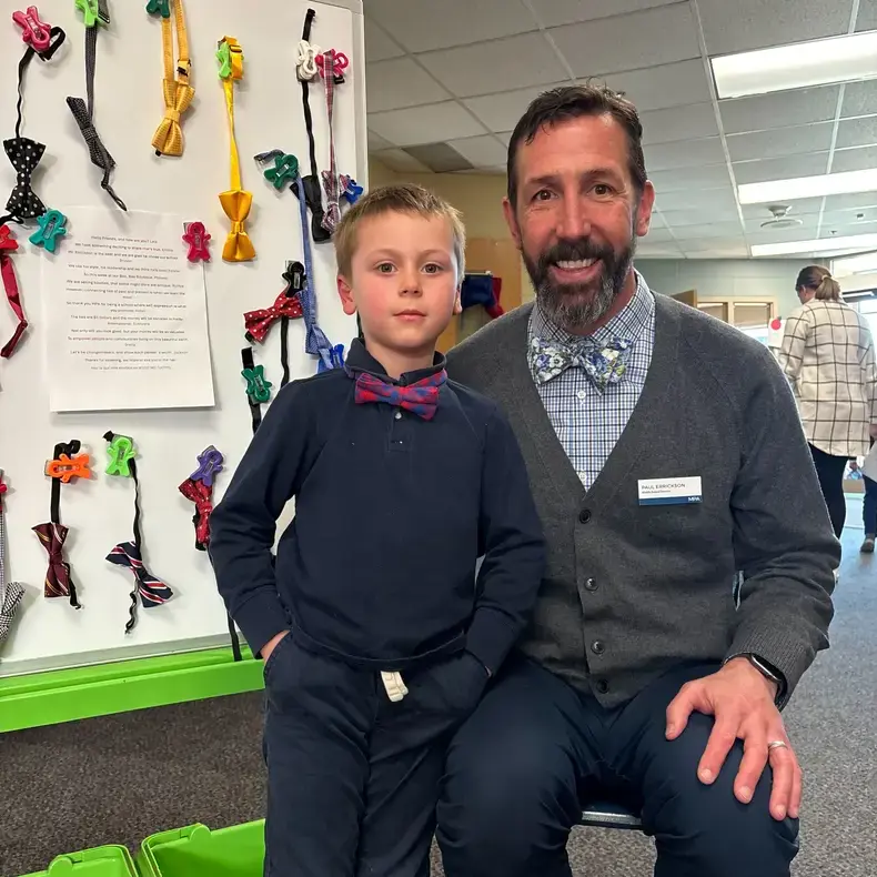 Student posing with a faculty member
