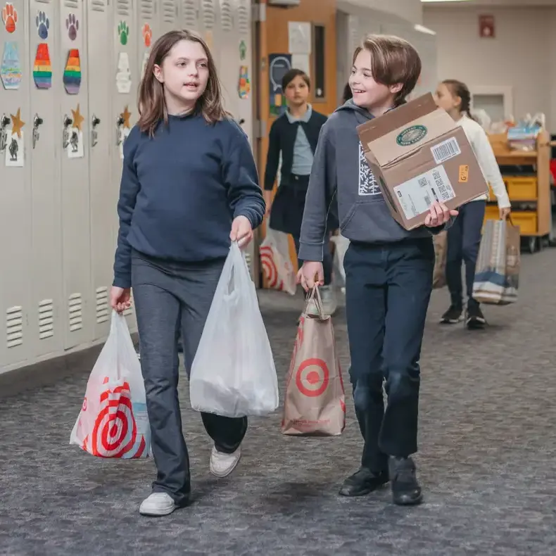 Students arriving with school supplies