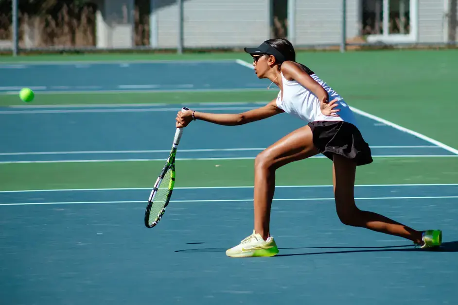 Student playing tennis
